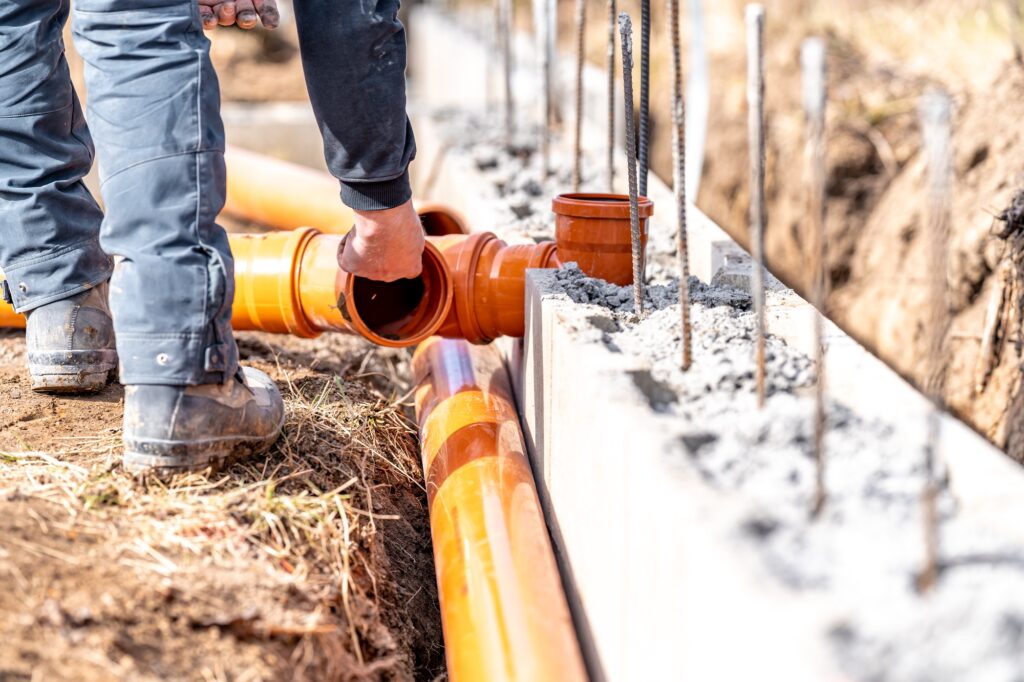 installation of a sewage plastic pipe during the construction of a house